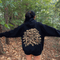 Featuring the phrase "Into the Forest" uniquely crafted in tree branch lettering, this design brings the beauty and mystery of the woods to life.